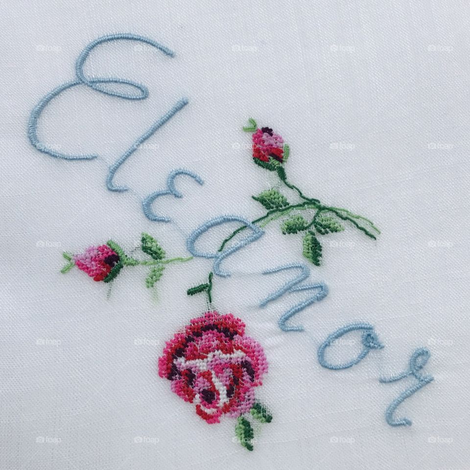 Eleanor first name can be framed and hung on wall in diamond shape with white background