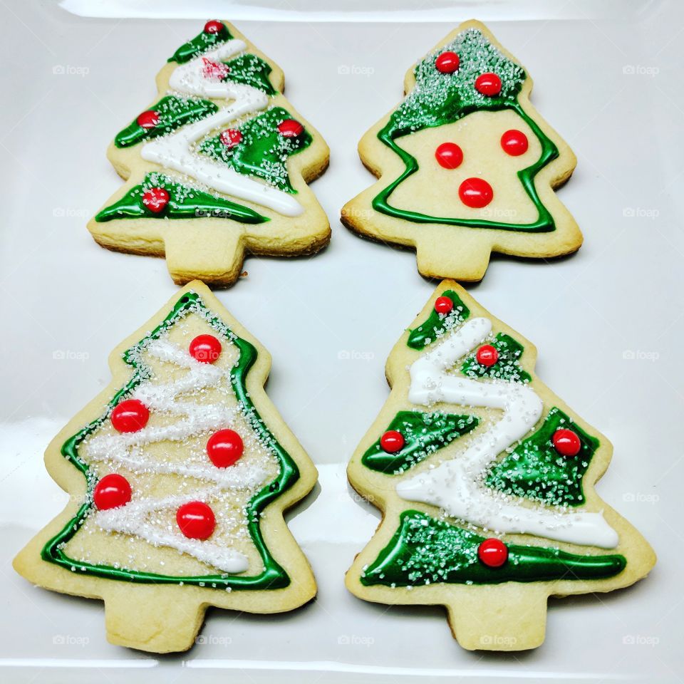 First attempt at Christmas cookies. The base is a traditional sugar cookie followed by cookie icing and dusting sugar.