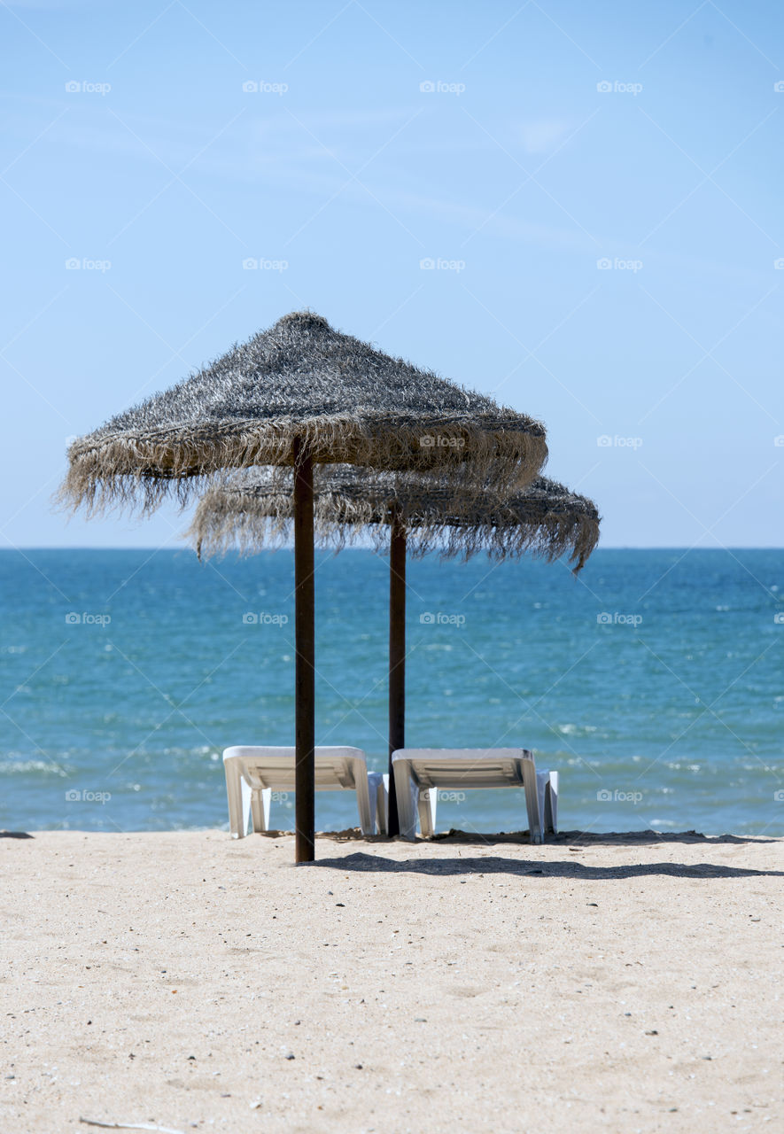 parasols on tropical beach . parasols on tropical beach in Portugal 