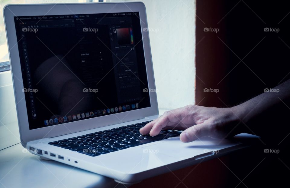 Hand typing on a Laptop 