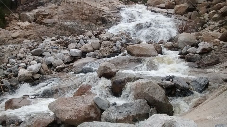 Rushing water through rocks