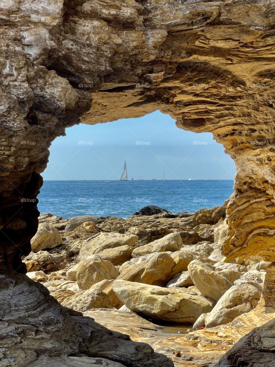 Sitting in a cave on Little Treasure Cove looking out at the ocean 