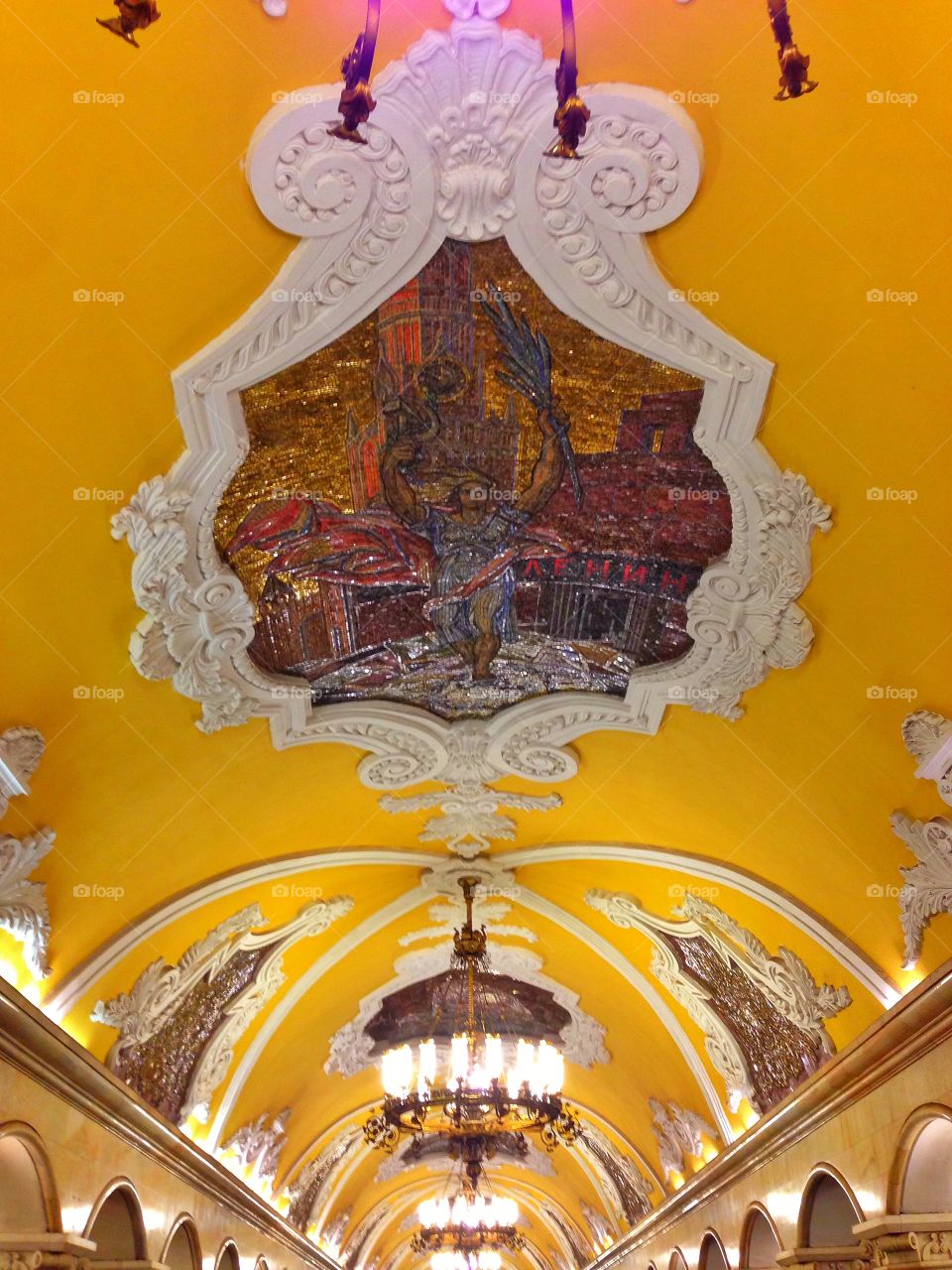 Soviet colorful mosaic on the yellow ceiling in Moscow, Russia