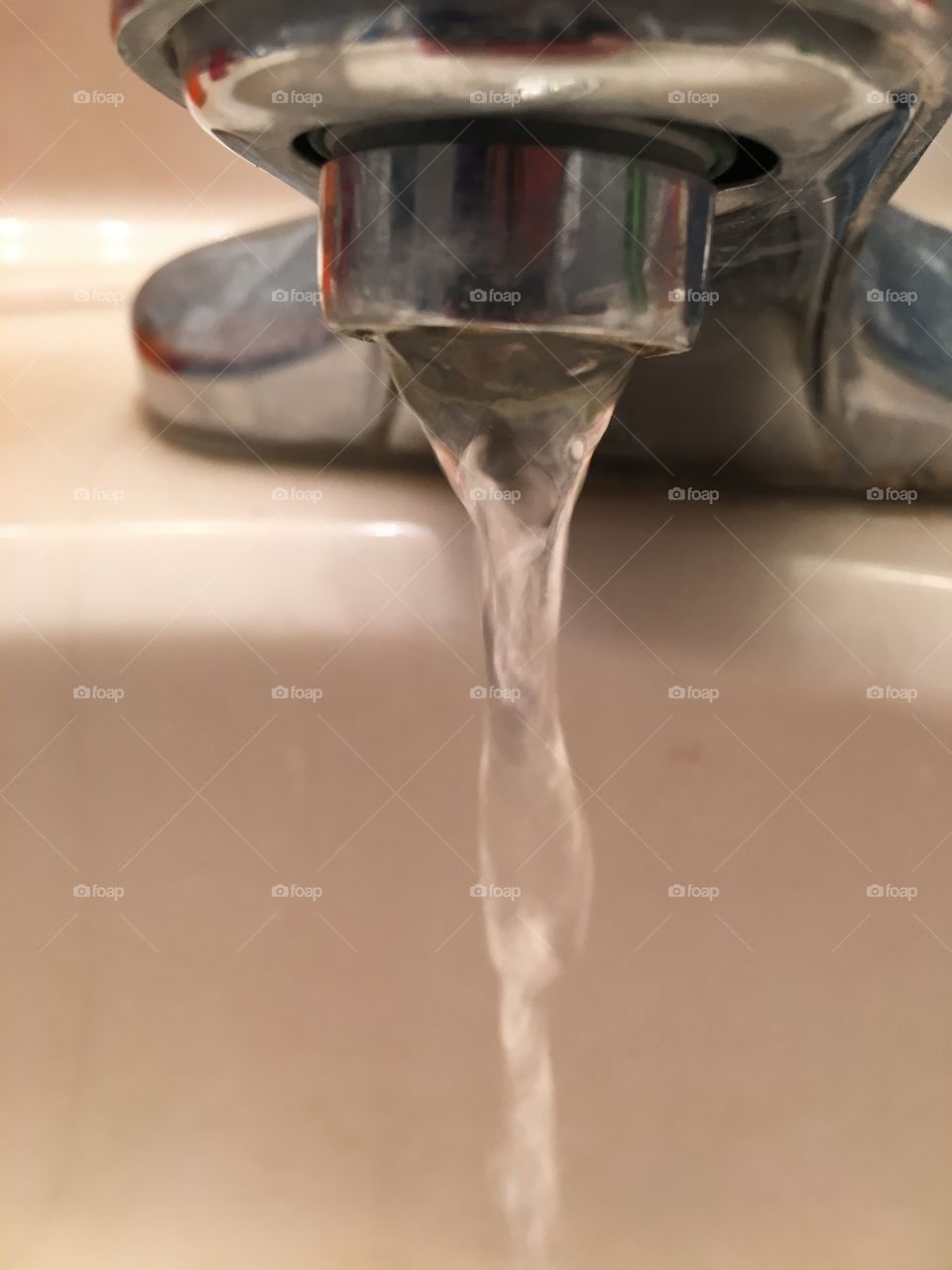 Clear running water from bathroom faucet 