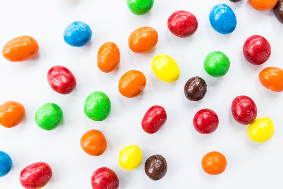 Colorful candies on white background 