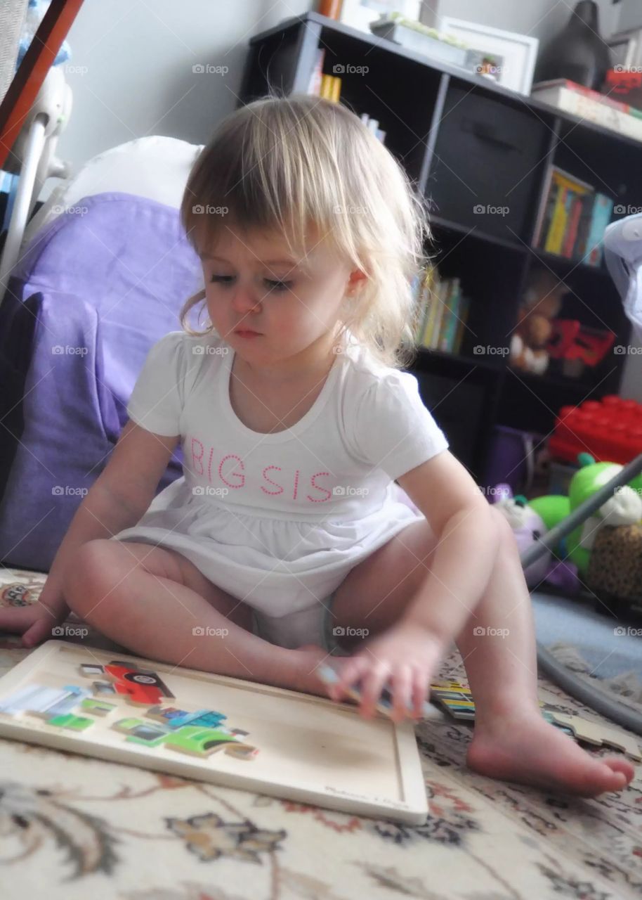 Photojournalism of a toddlers antics - puzzle time