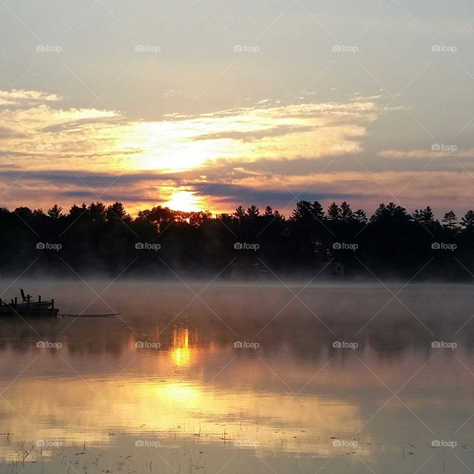 Sunrise  and fog on the lake