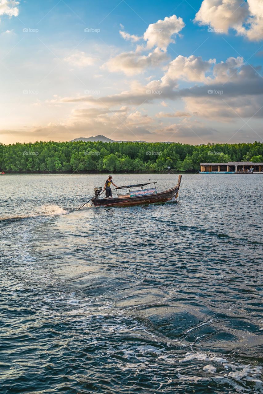 Boat and sea in sunset moment