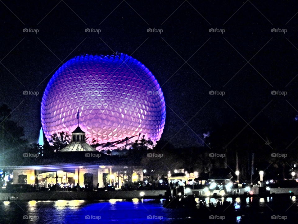 Spaceship Earth shines brightly at the entrance to EPCOT at the Walt Disney World Resort in Orlando, Florida.