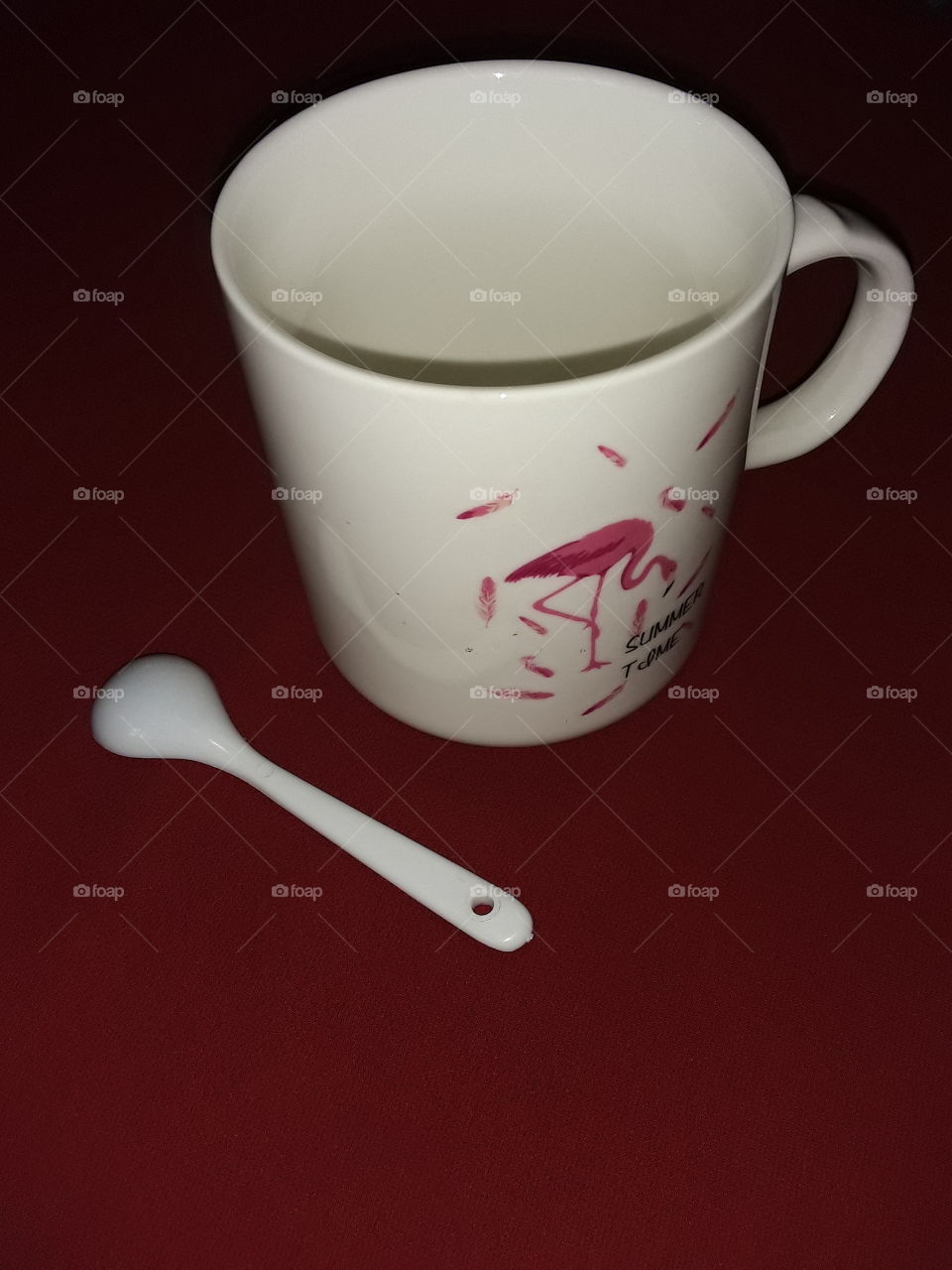 A teacup and spoon. teacup is a cup for drinking tea.lt may be with or without a handle generally a small one that may be grasped.