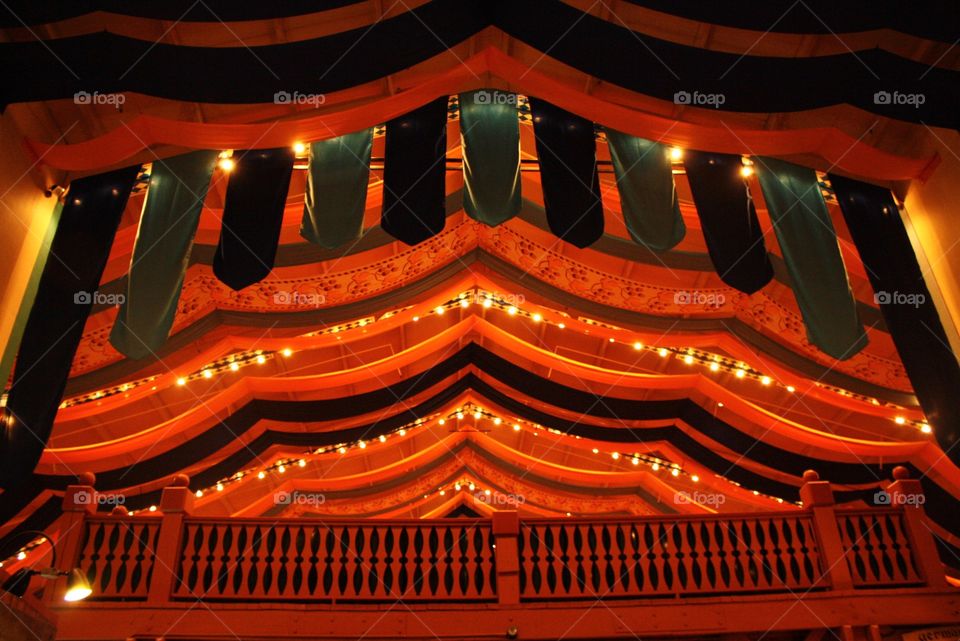 Lights and Banners on High Ceiling at Night