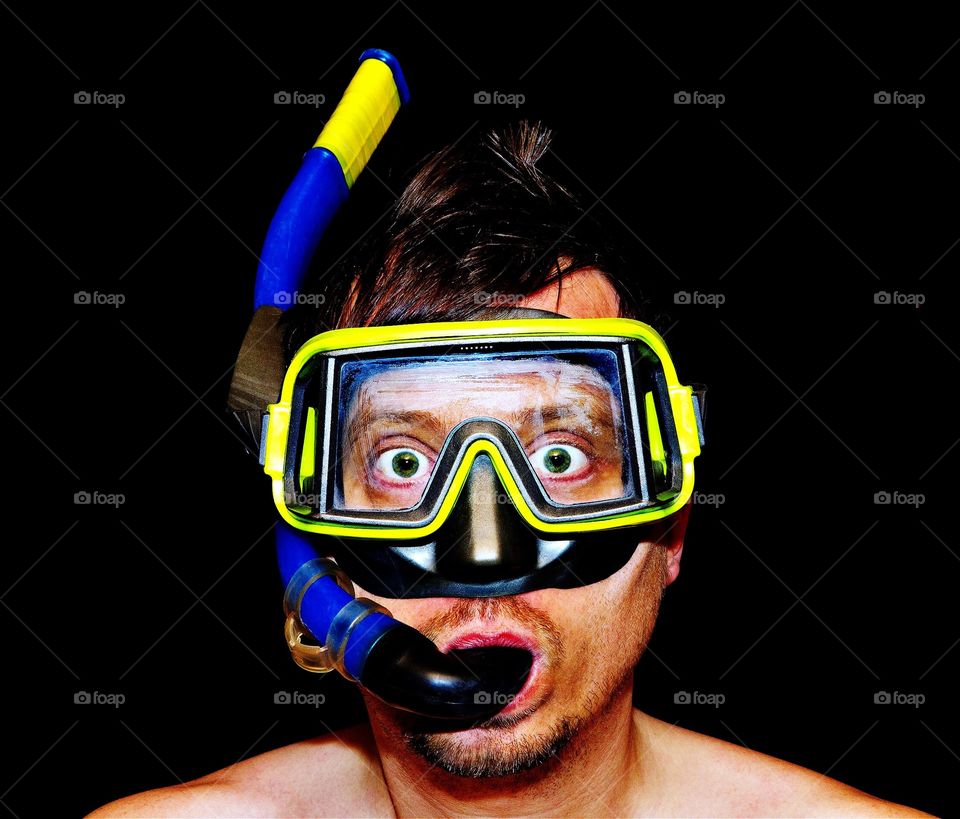 The diver. Funny portrait of a man with diver mask and snorkel 