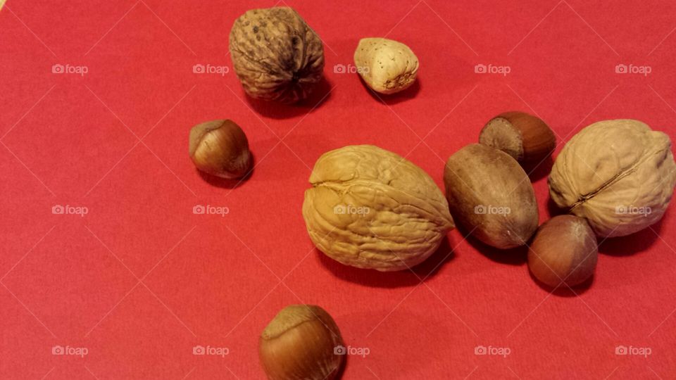mixed nuts on red background