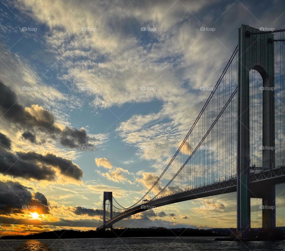 The Verrazzano-Narrows Bridge connecting Brooklyn and Staten Island in New York City at sunset 