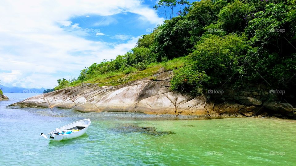 A small boat taking you to a paradise island.
