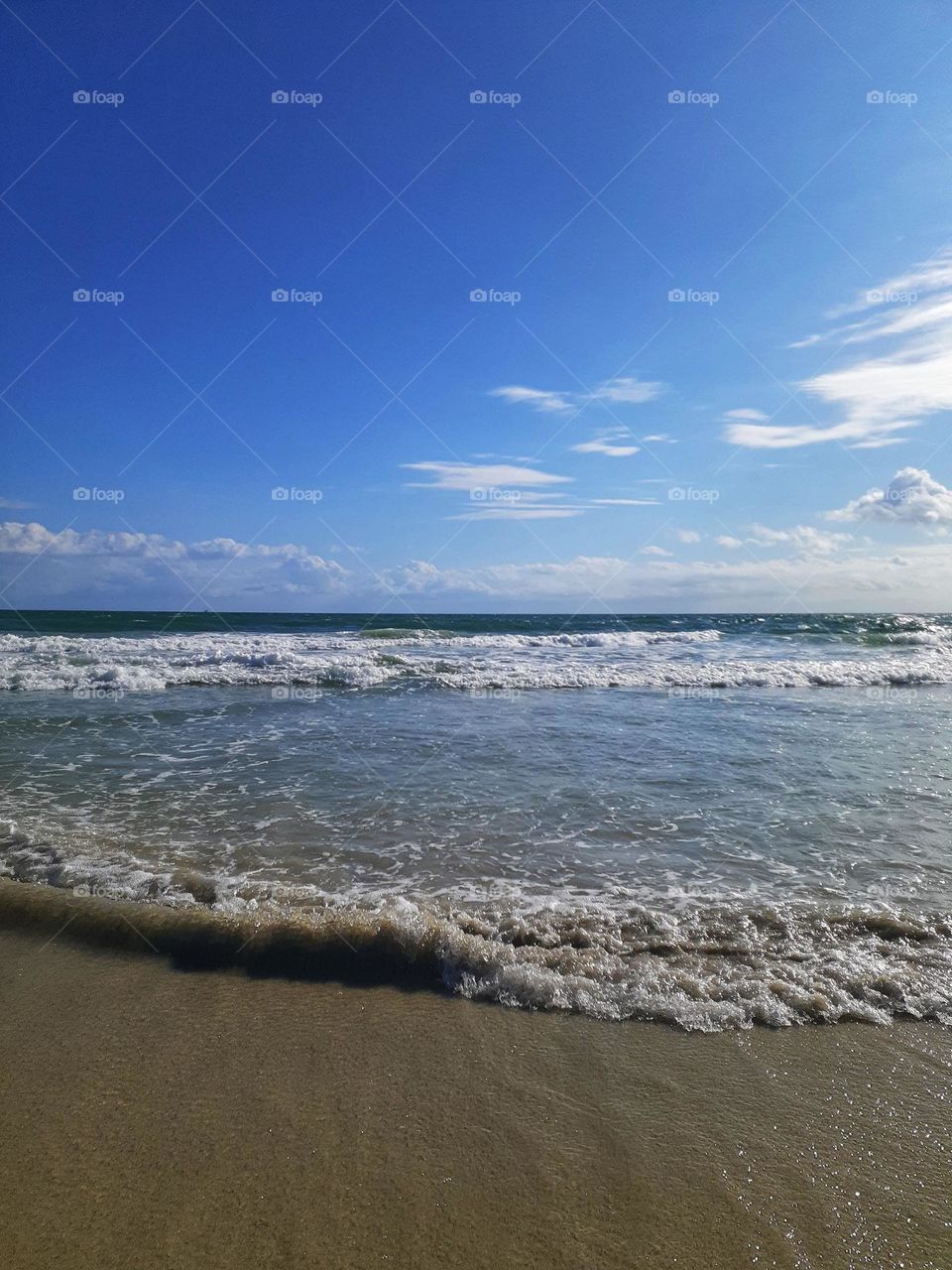 A landscape photo showing a beautiful day with blue sky at Indian Rocks Beach in Tampa, Florida.