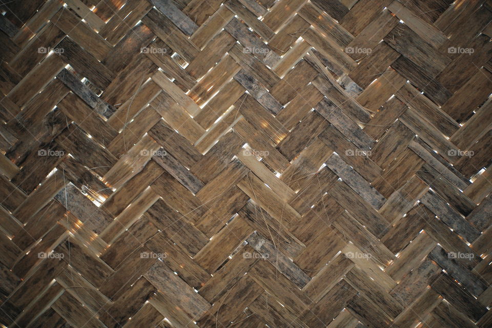 A pattern of bamboo webbing. Indonesian usually used this as the wall of their home in the past.