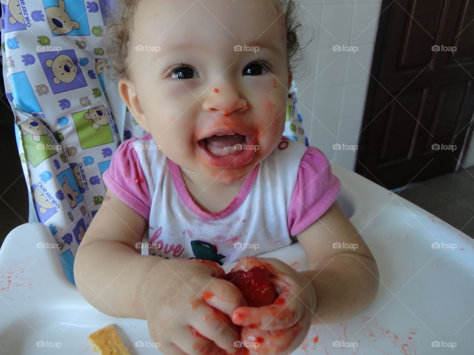 Baby smashing food in high chair