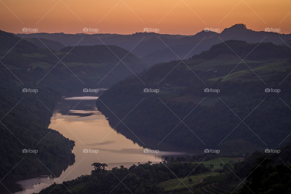 Sunset in the river flow