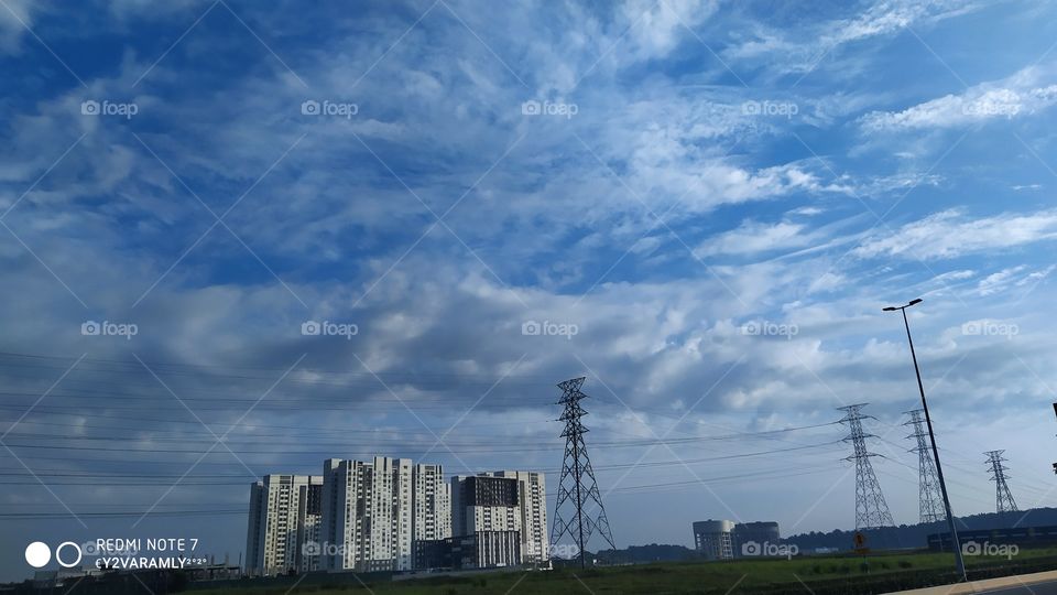Small Building Under A Cloud
