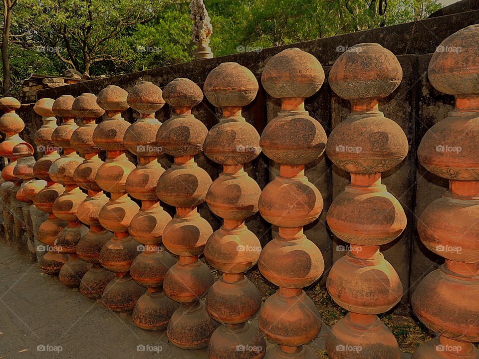 A series earthen pots positioned beautifully at Rock Garden Chandigarh 