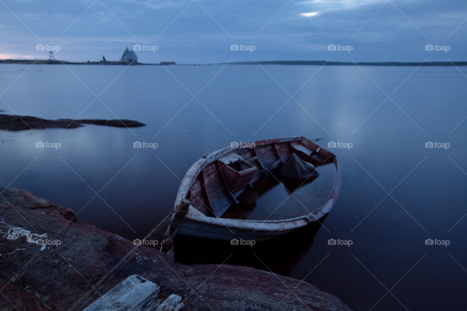 White Sea at early motning. Wooden church in Rabocheostrovsk, Kem, Russia