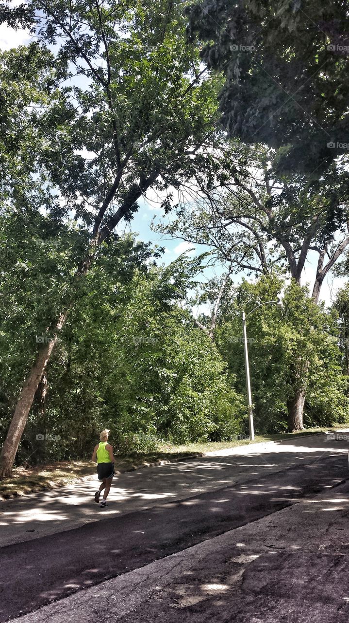 Love Running. Running on Tree Lined Street