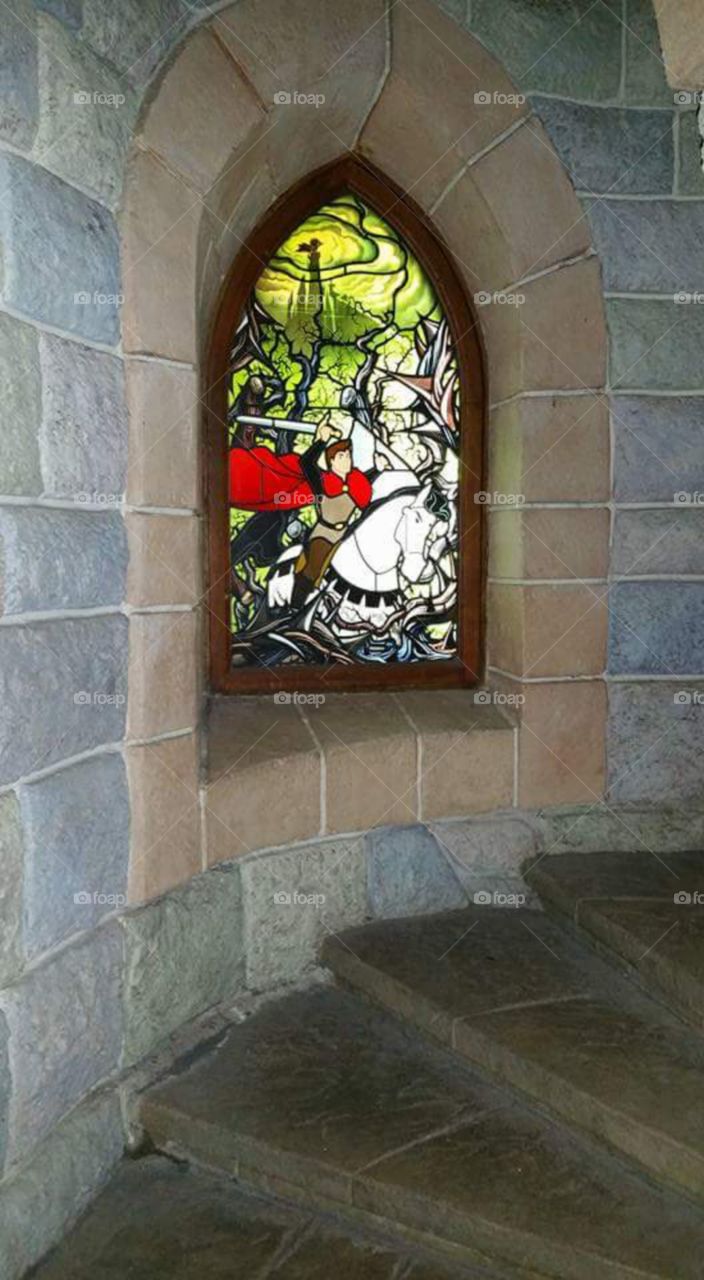 Disney land Paris / Euro Disneys 

one of Sleeping beauty castles 
stain glass window


(series available  )

Sleeping Beauty Castle is the fairy tale structure castle at the center of Disneyland Park, Hong Kong Disneyland and Disneyland Paris. It is based on the late-19th century Neuschwanstein Castle in Bavaria, Germany,with some French inspirations (especially Notre Dame de Paris and the Hospices de Beaune).