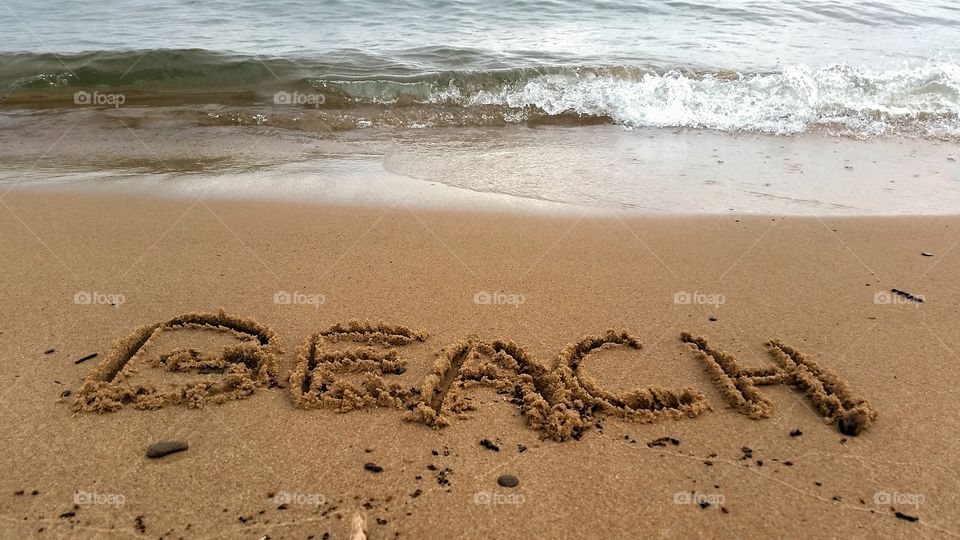 High angle view of text on beach