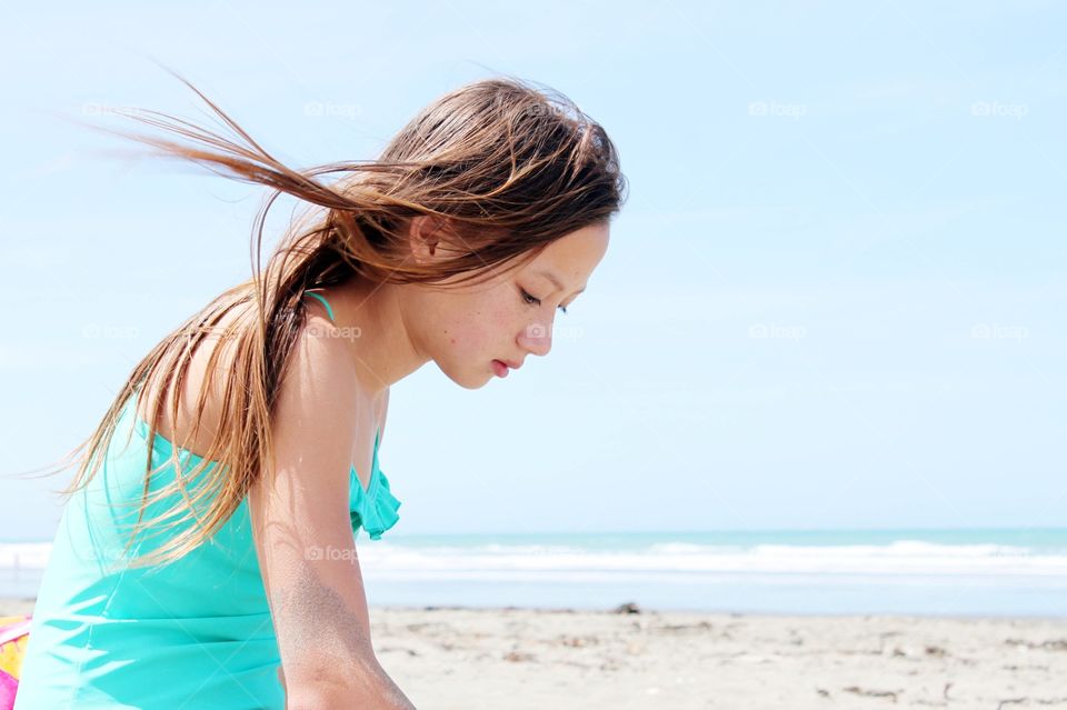 Side view of a girl on beach