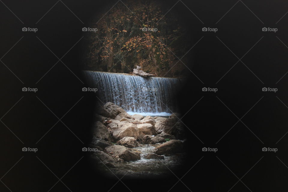 waterfall through keyhole