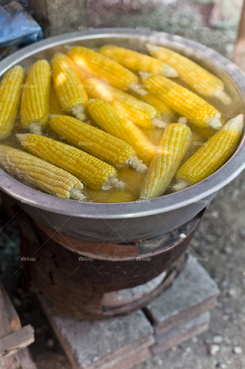 Yellow sweet corn boiling. At a local Thai market