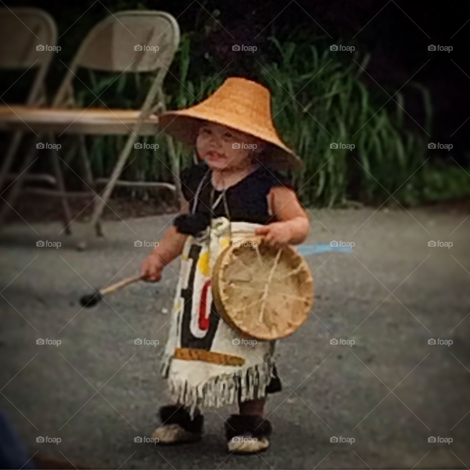 Dancer . Holding ceremonial drum 