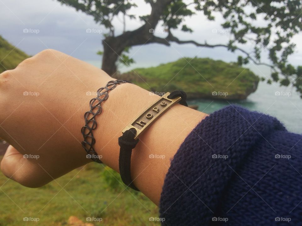 Wearing HOPE bracelet at beautiful seashore.