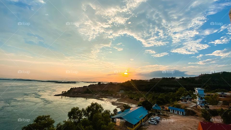 clouds around the sun at sunset moment
