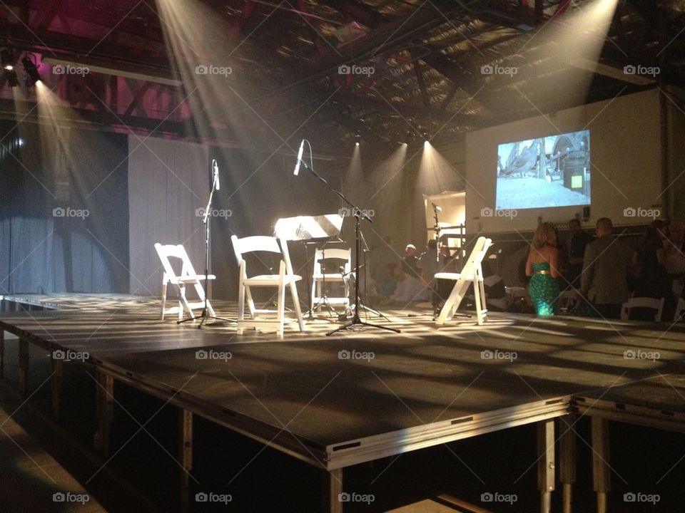 Chairs on stage waiting