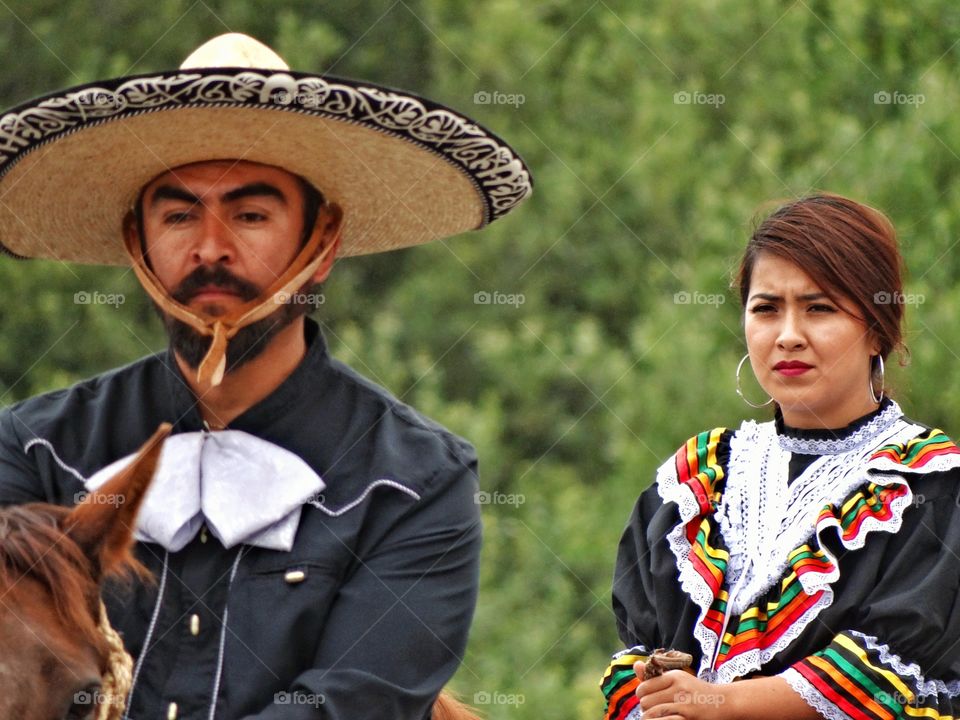 Cowboy With Cowgirl. Traditional Mexican Vaquero Riding Horses With His Wife
