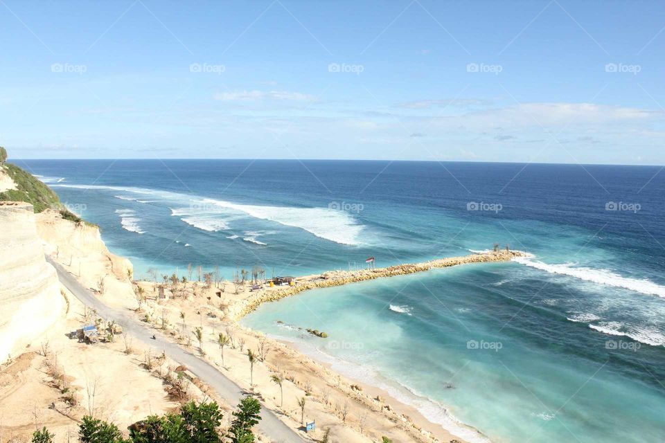 White sandy beach with blue seawater
