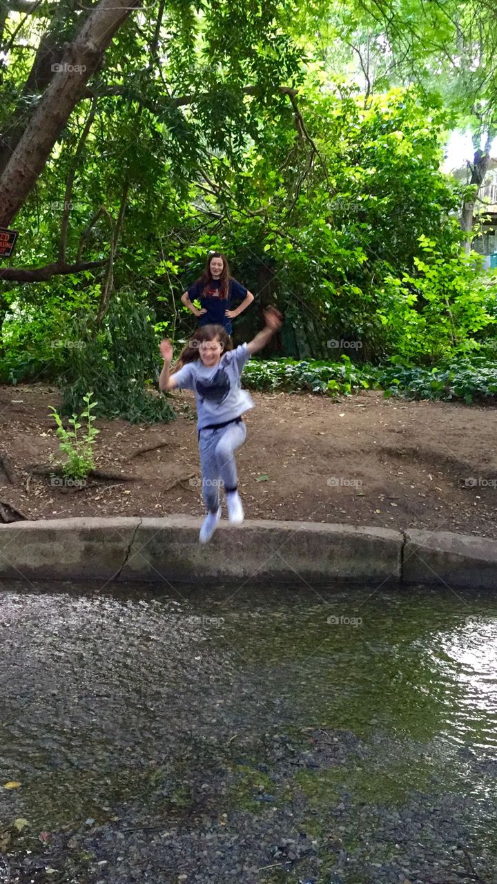 Girl jumping in water