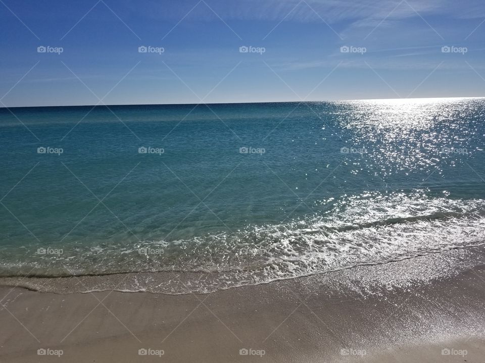 a sunny clear water beach