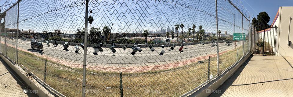 Panorama view of the Downtown Los Angeles skyline (background) and the Hollywood Freeway (foreground) shot from the East LA neighborhood of Boyle Heights 