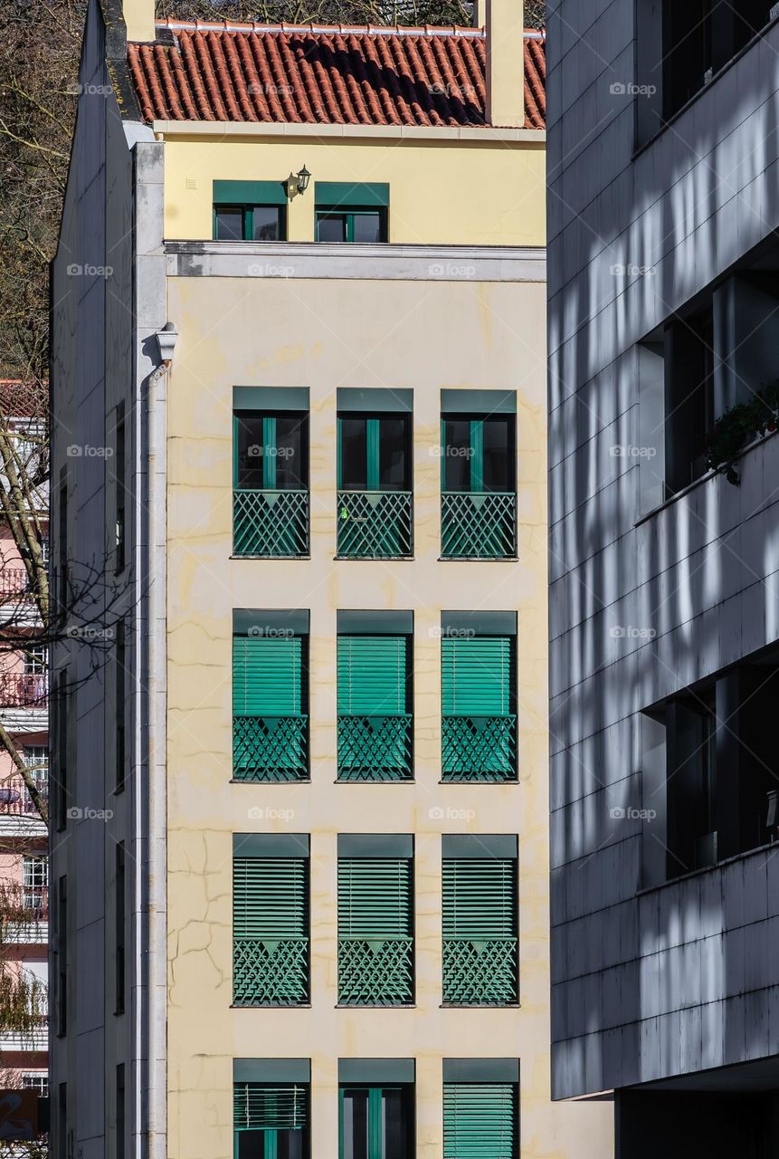 Green shuttered apartments in Leiria Portugal 