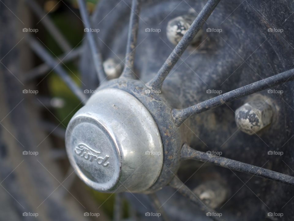 The hubcap on an old Ford Pickup truck 