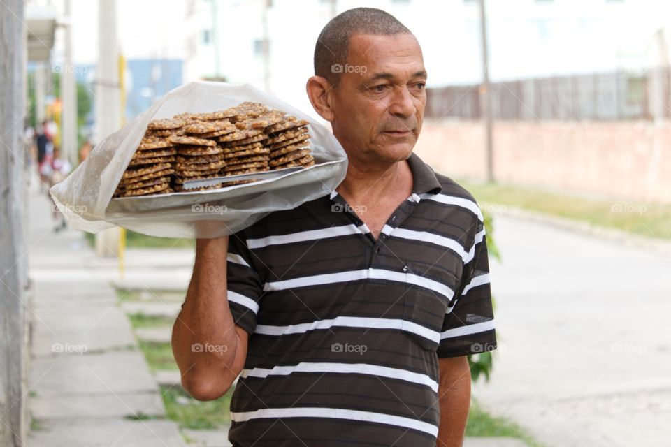 Cuban People.Turrón de maní street vendor in Guantanamo.