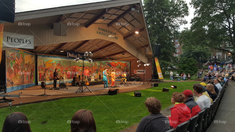 Summer fun during a concert at a park amphitheater.