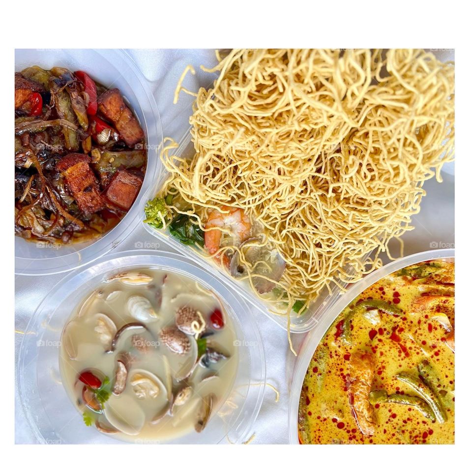 Asian food includes lala clam soup, curry fish head, bitter gourd pork and crispy twin tower noodles 