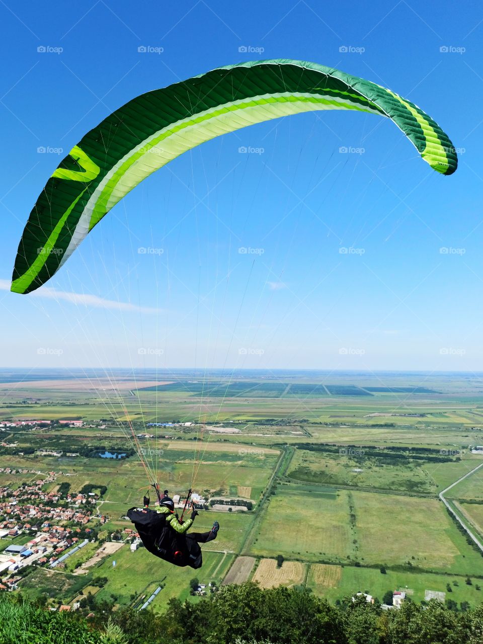 paraglider in the clear blue sky