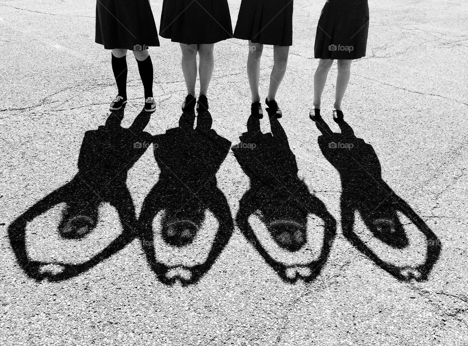 Black and white, four girls making a heart shadow