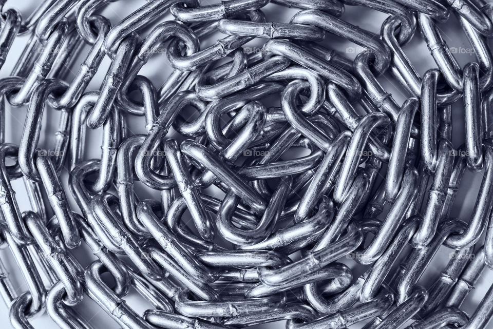 Close-up of a curled up metal chain