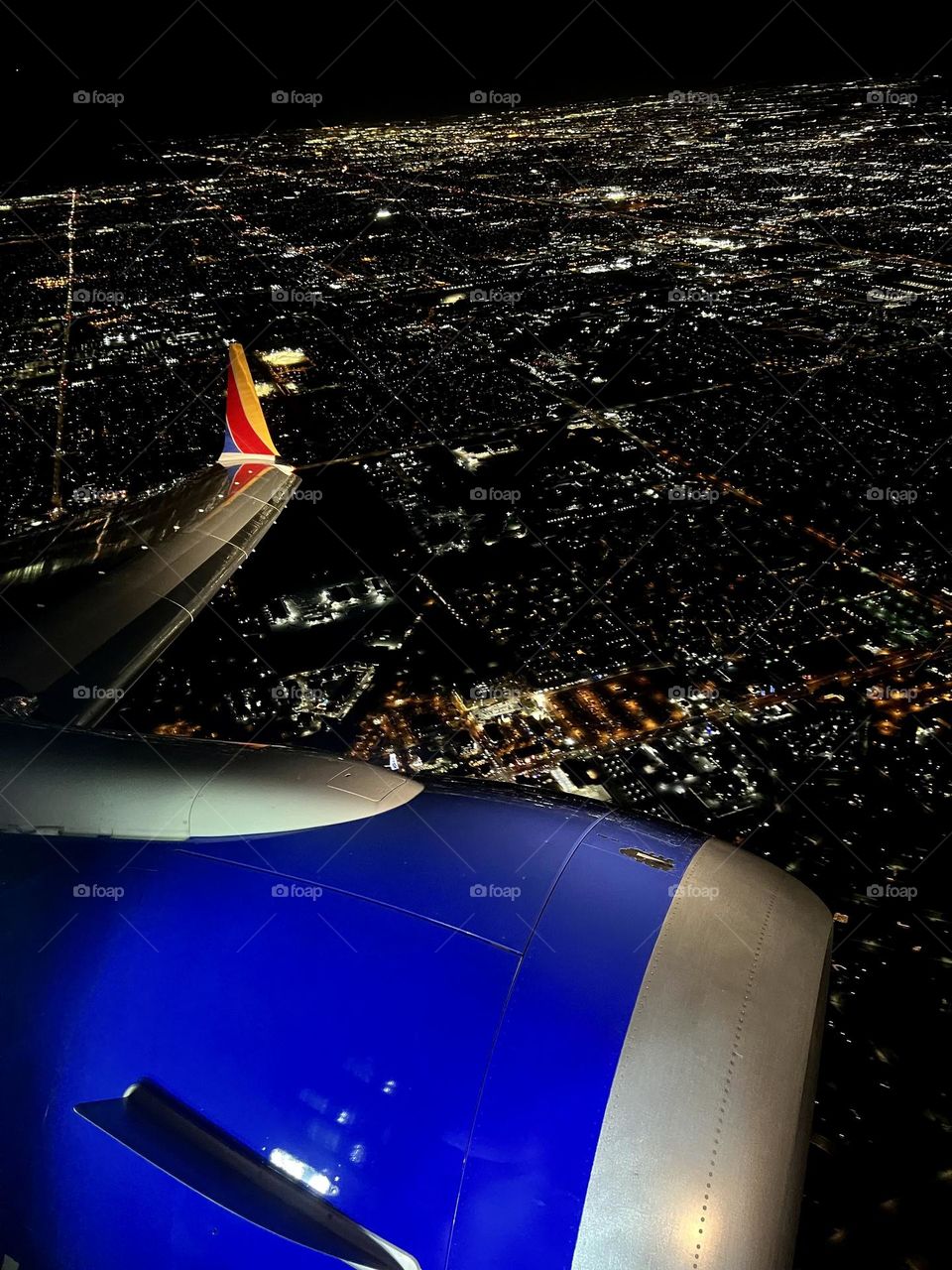 Southwest Airlines Boeing 737 flying over Gilbert Arizona at night about to land at Phoenix Sky Harbor International Airport (PHX)